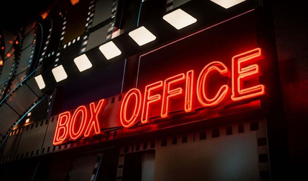 Red neon sign saying "Box Office"