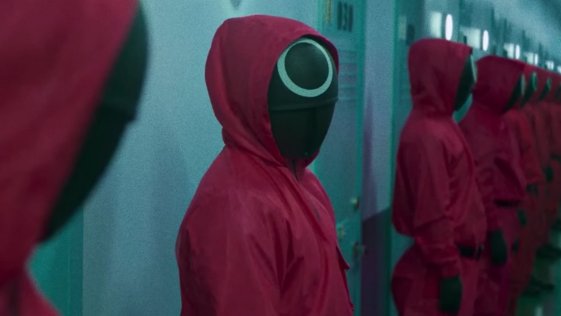 Group of Masked Individuals in Red Jumpsuits from The Series "Squid Game"