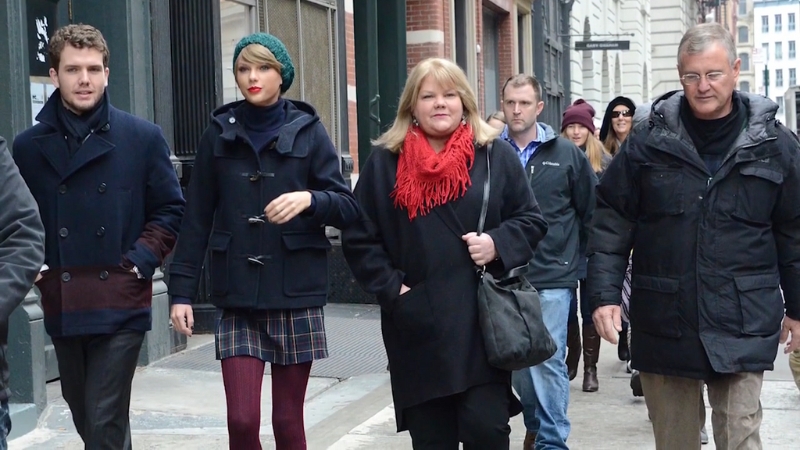 Members of the Swift family walking together on a city street