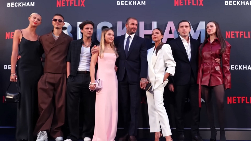 The Beckham family posing together on the red carpet at a Netflix event