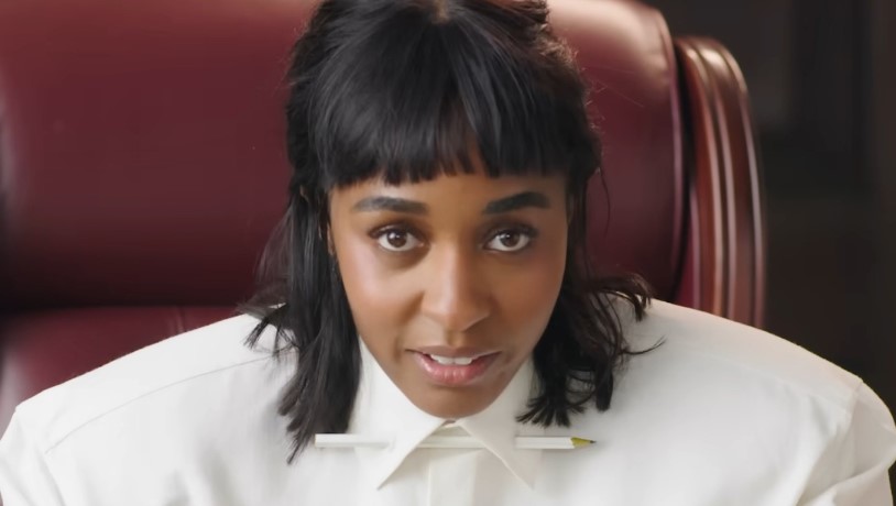Ayo Edebiri acting in a scene as a court judge