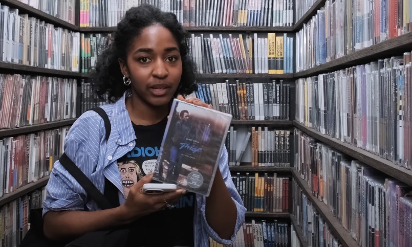 Ayo Edebiri showing her book collection