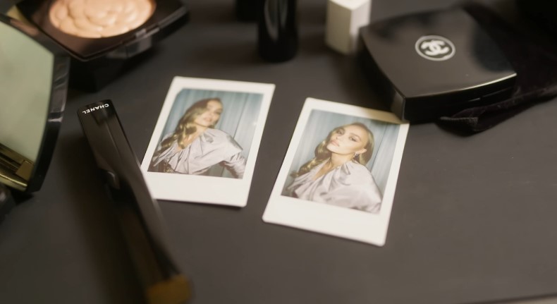 Chanel beauty essentials laid out with Polaroid photos of Lily-Rose Depp