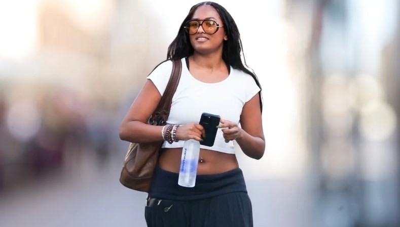 Sasha Obama spotted out and about, holding a phone and a bottle of Smartwater